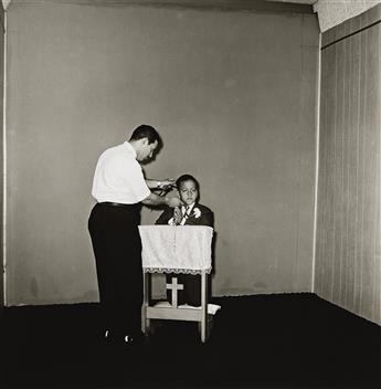 DIANE ARBUS (1923-1971) Photographer Posing Communion Boy, N.Y.C. 1968; printed 2003 by Neil Selkirk.                                            